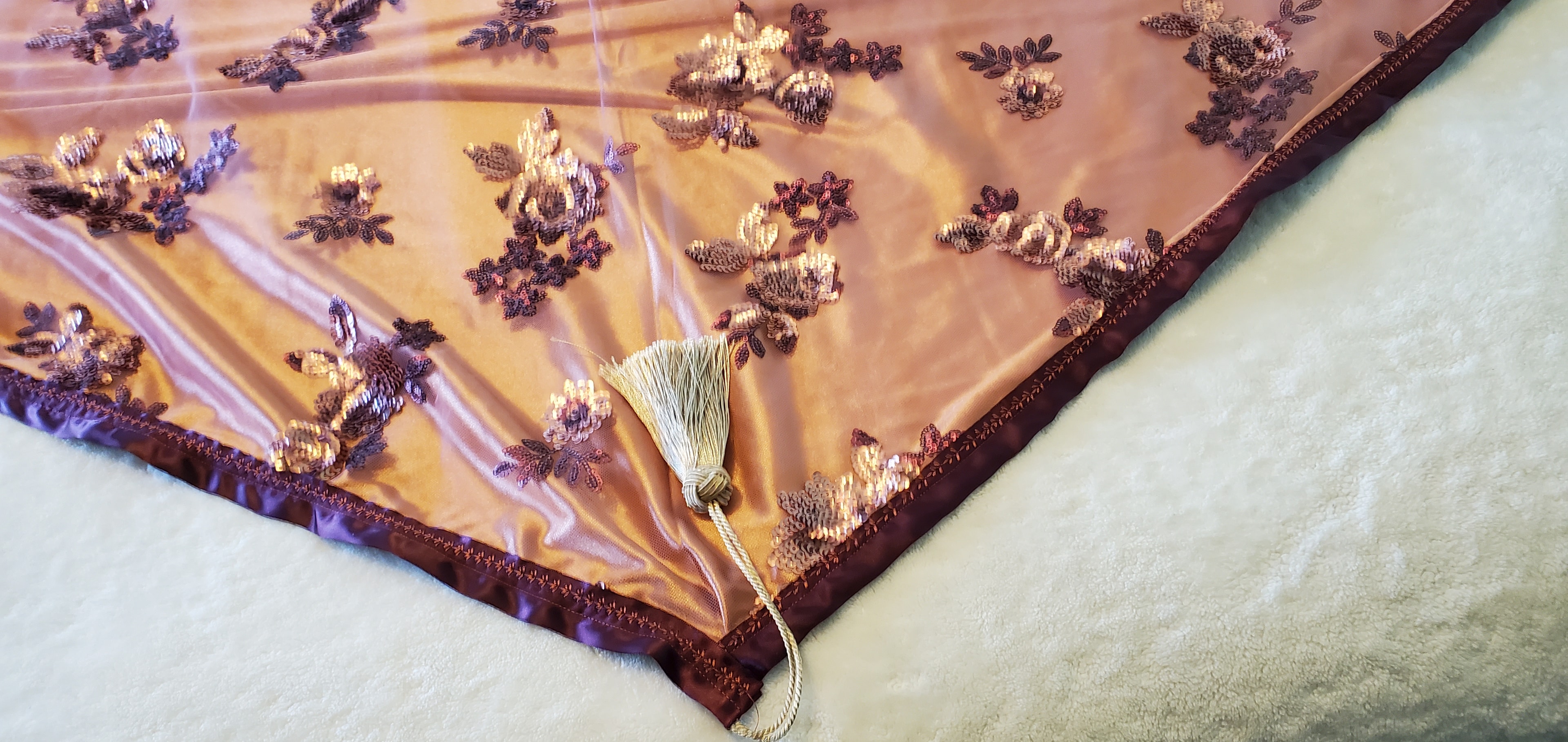 A woman wrapped in a handmade Sacred Rest prayer shawl